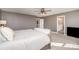 A bright main bedroom with ensuite bath showing light grey walls and comfortable carpet at 15131 Oleander Dr, Charlotte, NC 28278