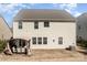 Exterior back view of the home highlighting the windows and patio at 15131 Oleander Dr, Charlotte, NC 28278