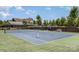 Well-maintained community tennis courts with green and blue surfaces, trees, and nearby clubhouse at 15131 Oleander Dr, Charlotte, NC 28278