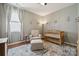 Cozy Bedroom with crib, comfy chair and plenty of natural light at 1622 Candlewood Ridge Ln, Matthews, NC 28105