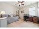 Sunlit bedroom, perfect for home office or guest suite, features a ceiling fan at 1622 Candlewood Ridge Ln, Matthews, NC 28105