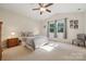 Spacious main bedroom featuring vaulted ceilings, ceiling fan, and natural light at 1622 Candlewood Ridge Ln, Matthews, NC 28105