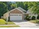 Charming home with a two-car garage and well-maintained lawn at 1622 Candlewood Ridge Ln, Matthews, NC 28105