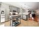Modern kitchen featuring stainless steel appliances, granite countertops, and gray cabinetry at 1622 Candlewood Ridge Ln, Matthews, NC 28105
