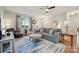 Comfortable living room featuring hardwood floors, a plush sofa, and neutral decor at 1622 Candlewood Ridge Ln, Matthews, NC 28105