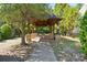 Picnic shelter with stone supports, picnic tables, and walkway perfect for community gatherings at 1622 Candlewood Ridge Ln, Matthews, NC 28105