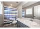 Small bathroom featuring light blue shower curtains, a toilet, and a sink at 17307 Villanova Rd, Huntersville, NC 28078