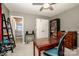 Carpeted bedroom showing a desk, closet, and a doorway leading to a bathroom at 17307 Villanova Rd, Huntersville, NC 28078