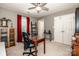 Bedroom featuring carpet, red curtains, ceiling fan and light, and a closet at 17307 Villanova Rd, Huntersville, NC 28078