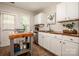 Functional kitchen with white cabinets, stainless steel appliances, and a convenient butcher block island at 17307 Villanova Rd, Huntersville, NC 28078
