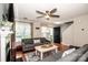 Bright and airy living room featuring hardwood floors, a ceiling fan, and comfortable seating at 17307 Villanova Rd, Huntersville, NC 28078