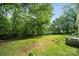 Expansive backyard with mature trees, offering ample space for recreation and outdoor enjoyment at 1917 Tom Sadler Rd, Charlotte, NC 28214