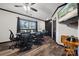 Versatile bonus room featuring dark trim, a ceiling fan, and a large table perfect for entertaining at 1917 Tom Sadler Rd, Charlotte, NC 28214