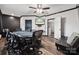 Game room with large poker table, wood-look floors, and dark trim at 1917 Tom Sadler Rd, Charlotte, NC 28214