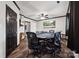 Game room with large poker table, wood-look floors, and dark trim at 1917 Tom Sadler Rd, Charlotte, NC 28214