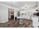 Cozy kitchen featuring white cabinetry, modern appliances, and a unique marble-topped table at 1917 Tom Sadler Rd, Charlotte, NC 28214