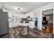 Kitchen featuring stainless steel appliances, a marble-topped dining table, and white cabinetry at 1917 Tom Sadler Rd, Charlotte, NC 28214