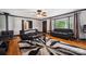 Bright living room with hardwood floors, modern furniture, fireplace, and a large window at 1917 Tom Sadler Rd, Charlotte, NC 28214
