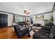 Bright living room with hardwood floors, dark trim, and large windows at 1917 Tom Sadler Rd, Charlotte, NC 28214