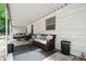 Covered patio featuring outdoor furniture, creating a cozy relaxation space at 1917 Tom Sadler Rd, Charlotte, NC 28214