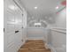 Bright upstairs hallway with wood flooring, neutral walls, and natural light from a window at the end at 1945 Hendricks St, Rock Hill, SC 29732