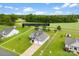 A well-maintained front yard and home with attached garage beneath a partly cloudy blue sky at 210 Dorothy Dr, China Grove, NC 28023