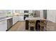 Kitchen features stainless appliances, granite counters, and an island with seating at 210 Dorothy Dr, China Grove, NC 28023