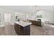 Open floor plan showcasing the kitchen island flowing into the living room and dining area at 210 Dorothy Dr, China Grove, NC 28023