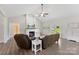Spacious living room featuring a fireplace, vaulted ceilings, wood floors, and plenty of natural light at 210 Dorothy Dr, China Grove, NC 28023
