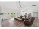 Cozy living room featuring a fireplace, vaulted ceilings, and access to the backyard at 210 Dorothy Dr, China Grove, NC 28023