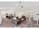 Open-concept living room flows to kitchen, featuring vaulted ceiling and modern finishes at 210 Dorothy Dr, China Grove, NC 28023