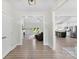 Open-concept living space with wood floors, fireplace, recessed lighting, and a view to the kitchen at 210 Dorothy Dr, China Grove, NC 28023