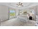 Bright main bedroom with tray ceilings and large windows overlooking the property at 210 Dorothy Dr, China Grove, NC 28023