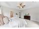 A lovely main bedroom featuring neutral carpeting and a ceiling fan at 210 Dorothy Dr, China Grove, NC 28023