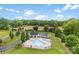A beautiful community pool with a gazebo, lush trees, landscaping, and parking at 210 Dorothy Dr, China Grove, NC 28023