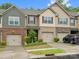 Townhome exterior showcasing attached garages, varied siding, and landscaped front yards in a desirable neighborhood at 234 Ascot Run Way, Fort Mill, SC 29715