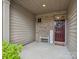 Inviting covered porch featuring brick accents and a welcome sign, adding a touch of warmth at 234 Ascot Run Way, Fort Mill, SC 29715