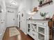 Inviting hallway with stairs and a stylish cabinet, adding character to the home's entrance at 234 Ascot Run Way, Fort Mill, SC 29715