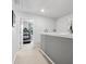 Clean hallway featuring neutral walls with open doorway leading to a room with a treadmill visible at 234 Ascot Run Way, Fort Mill, SC 29715