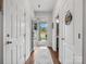 Bright hallway with wood floors, leading to the front door and a glimpse of the outdoors at 234 Ascot Run Way, Fort Mill, SC 29715