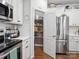 Well-organized kitchen featuring a stainless steel refrigerator, pantry, and ample cabinet space at 234 Ascot Run Way, Fort Mill, SC 29715