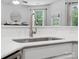 Modern kitchen sink with updated faucet and bright natural light from nearby window at 234 Ascot Run Way, Fort Mill, SC 29715