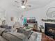 Comfortable living room with a fireplace, stylish decor, and abundant natural light at 234 Ascot Run Way, Fort Mill, SC 29715