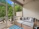 Cozy screened porch with comfortable seating, ideal for relaxing and enjoying the outdoor view at 234 Ascot Run Way, Fort Mill, SC 29715