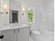 Bathroom featuring a modern vanity with marble countertop, and glass enclosed shower at 2710 Briarcliff Pl, Charlotte, NC 28207