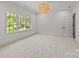 Spacious bedroom featuring recessed lighting, a doorway and a view of the outdoor scenery at 2710 Briarcliff Pl, Charlotte, NC 28207