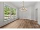 Bright dining room featuring large windows and hardwood floors, great for entertaining at 2710 Briarcliff Pl, Charlotte, NC 28207