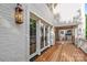Exterior shot showing wooden porch, brick wall, and light fixture at 2710 Briarcliff Pl, Charlotte, NC 28207