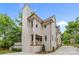 Home exterior showing tall chimney, siding, and copper gutters at 2710 Briarcliff Pl, Charlotte, NC 28207