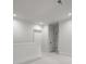 Hallway featuring white walls, doors and trim, illuminated by recessed lighting at 2710 Briarcliff Pl, Charlotte, NC 28207